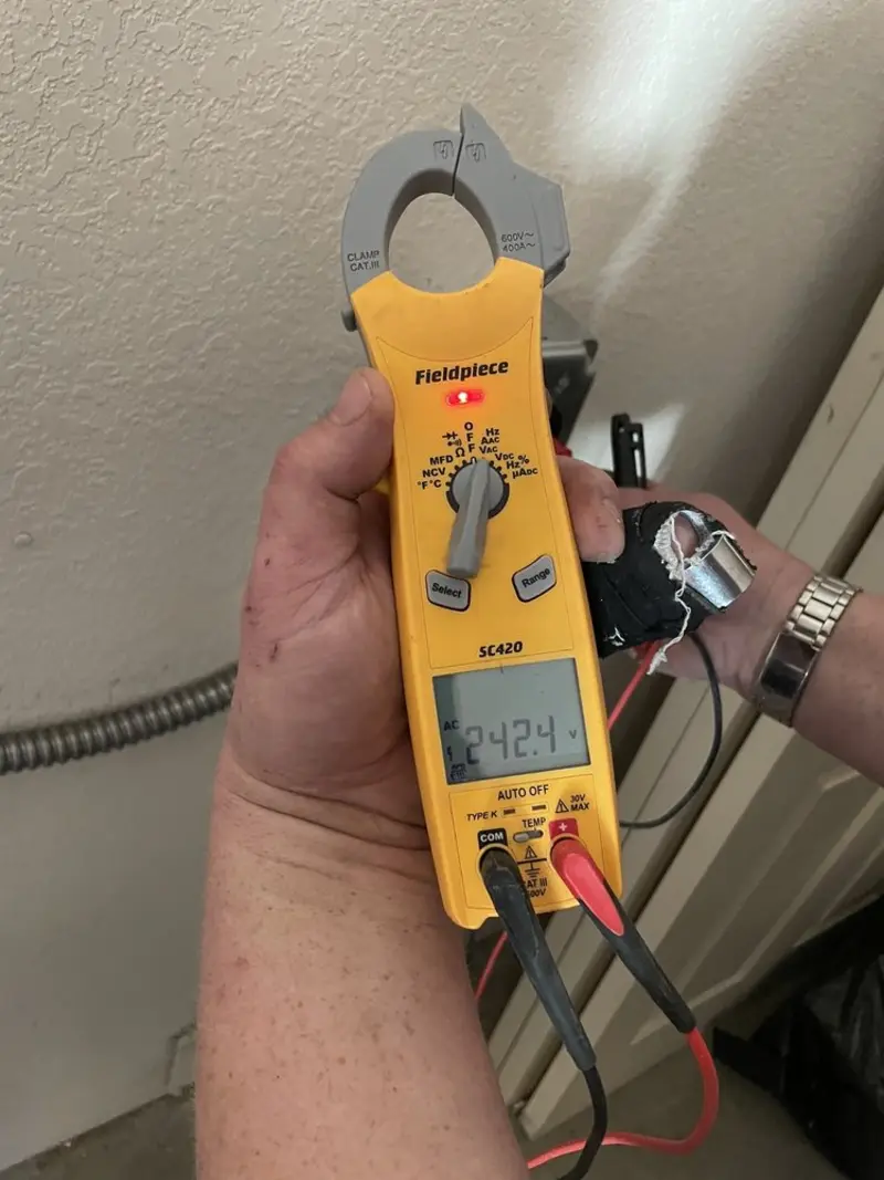 Voltage testing with clamp meter during Aluminum Wiring Replacement in Byron